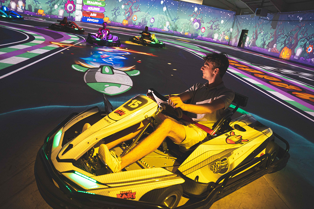 BattleKart player in their kart going to be hit by a green missile
