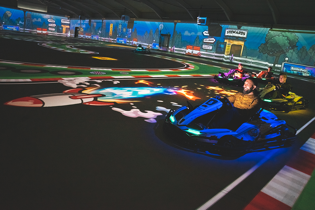 BattleKart player smiling in their kart as they avoided an opponent's missile