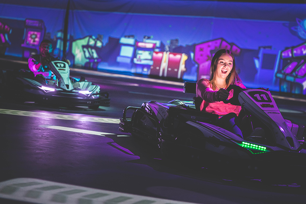 BattleKart player smiles in their kart while playing BattlePool mode